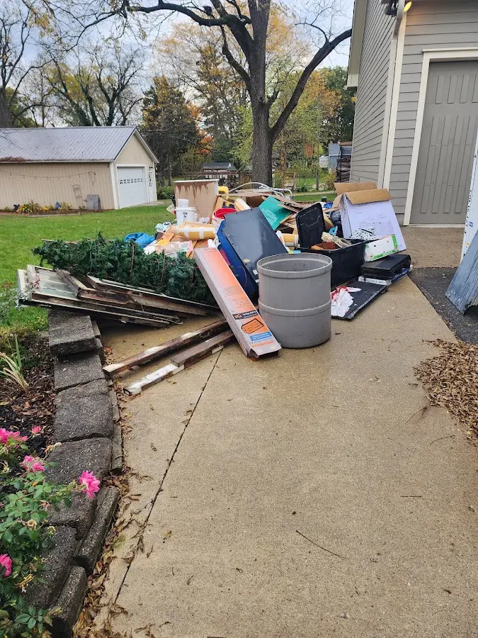 Dumpster being loaded with debris for Commercial Dumpster Rental in Bridgewater Town